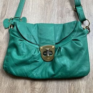 Vintage Aldo genuine leather green purse with brass buckle.